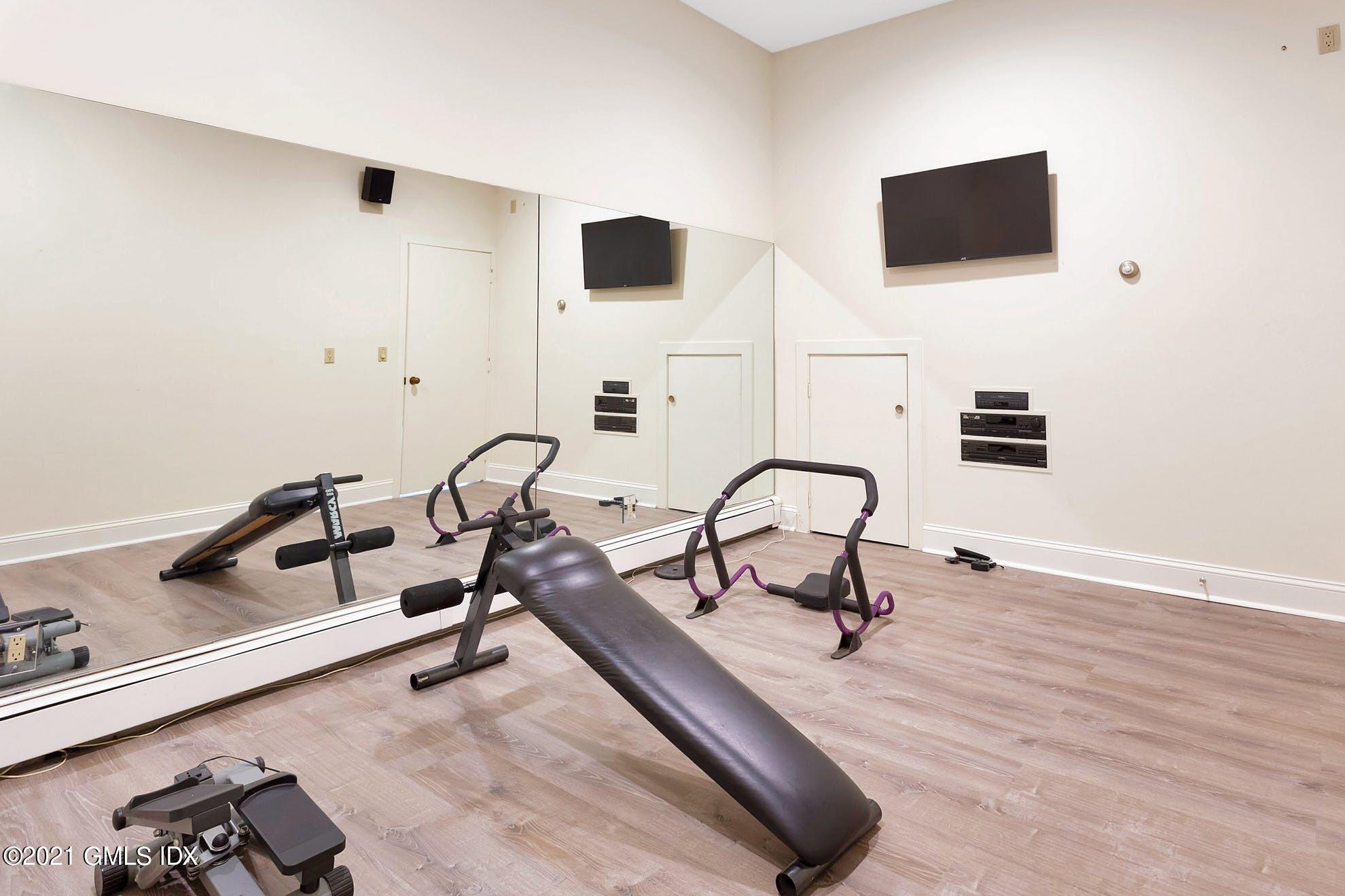 7 Chateau Ridge Road Greenwich, CT 06831 - Photo 21 of 36 a living room with furniture and a flat screen tv