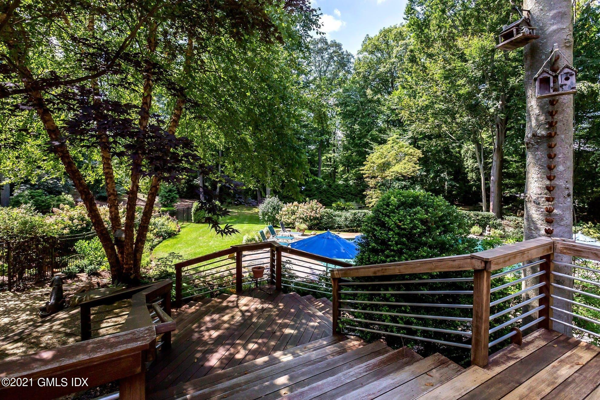 7 Chateau Ridge Road Greenwich, CT 06831 - Photo 25 of 36 a view of a bench in a garden