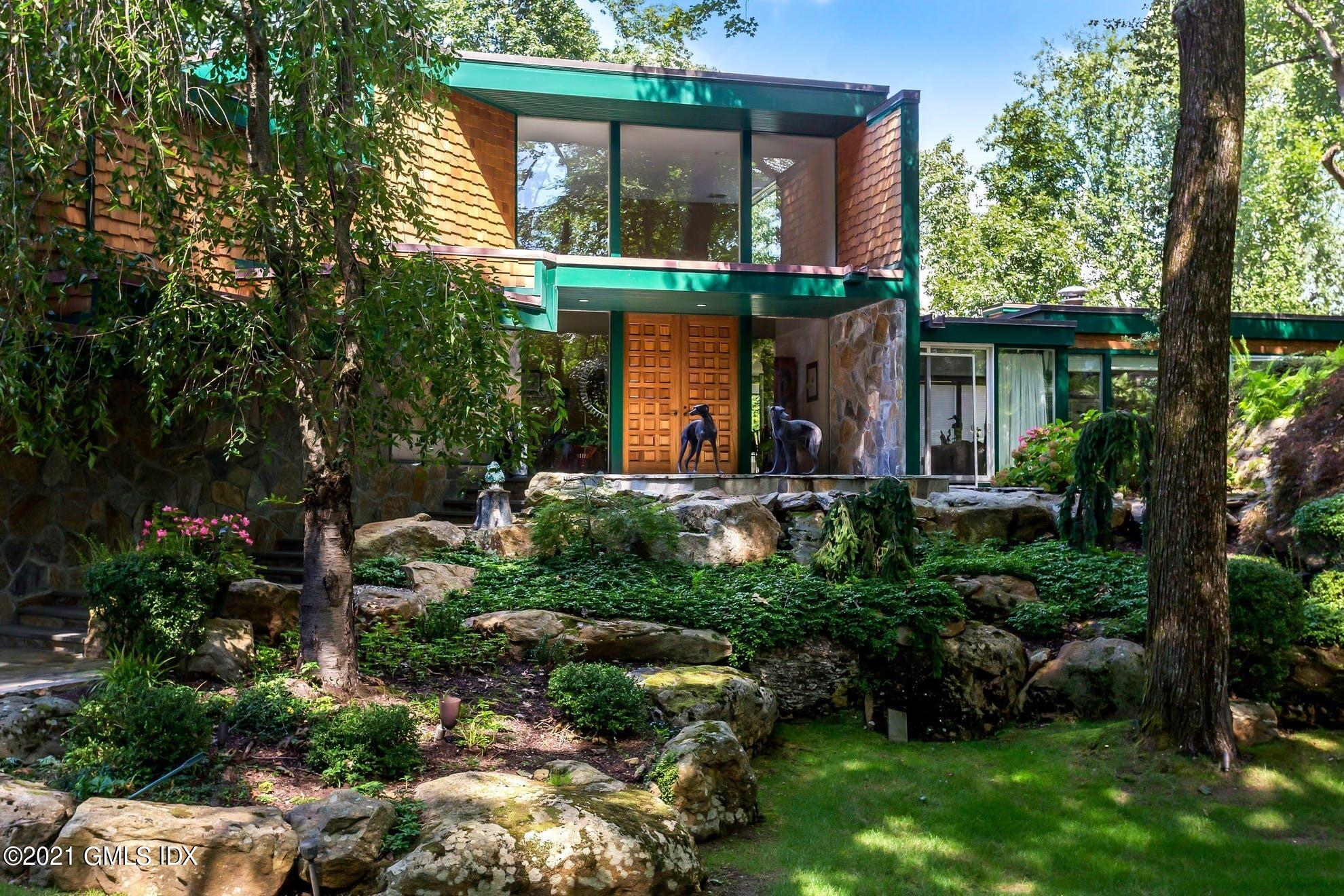 7 Chateau Ridge Road Greenwich, CT 06831 - Photo 28 of 36 front view of house with a yard