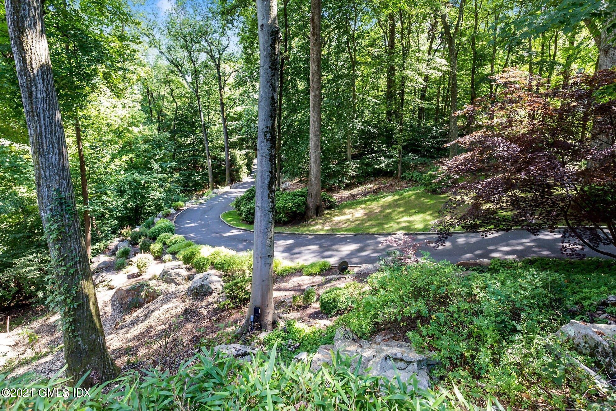 7 Chateau Ridge Road Greenwich, CT 06831 - Photo 30 of 36 a view of a tree with a yard