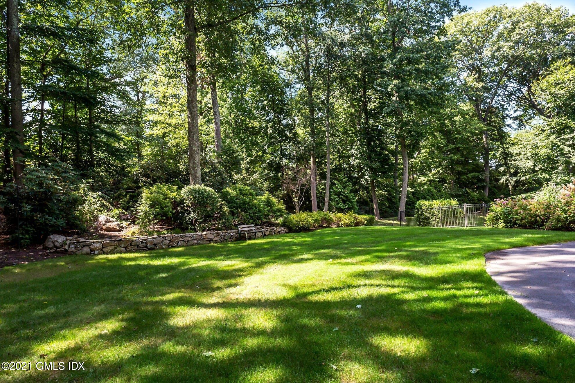 7 Chateau Ridge Road Greenwich, CT 06831 - Photo 33 of 36 a view of a park with large trees