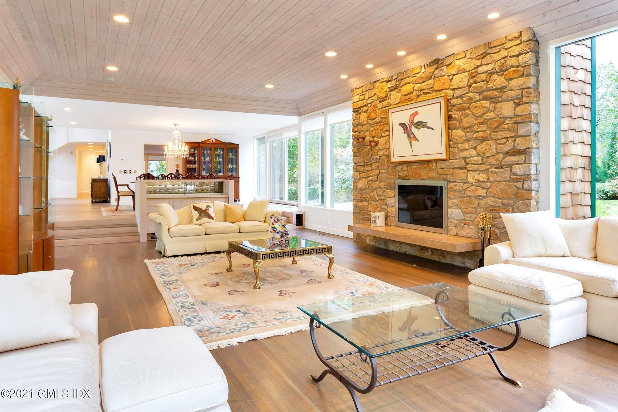 7 Chateau Ridge Road Greenwich, CT 06831 - Photo 5 of 36 a living room with furniture and a fireplace