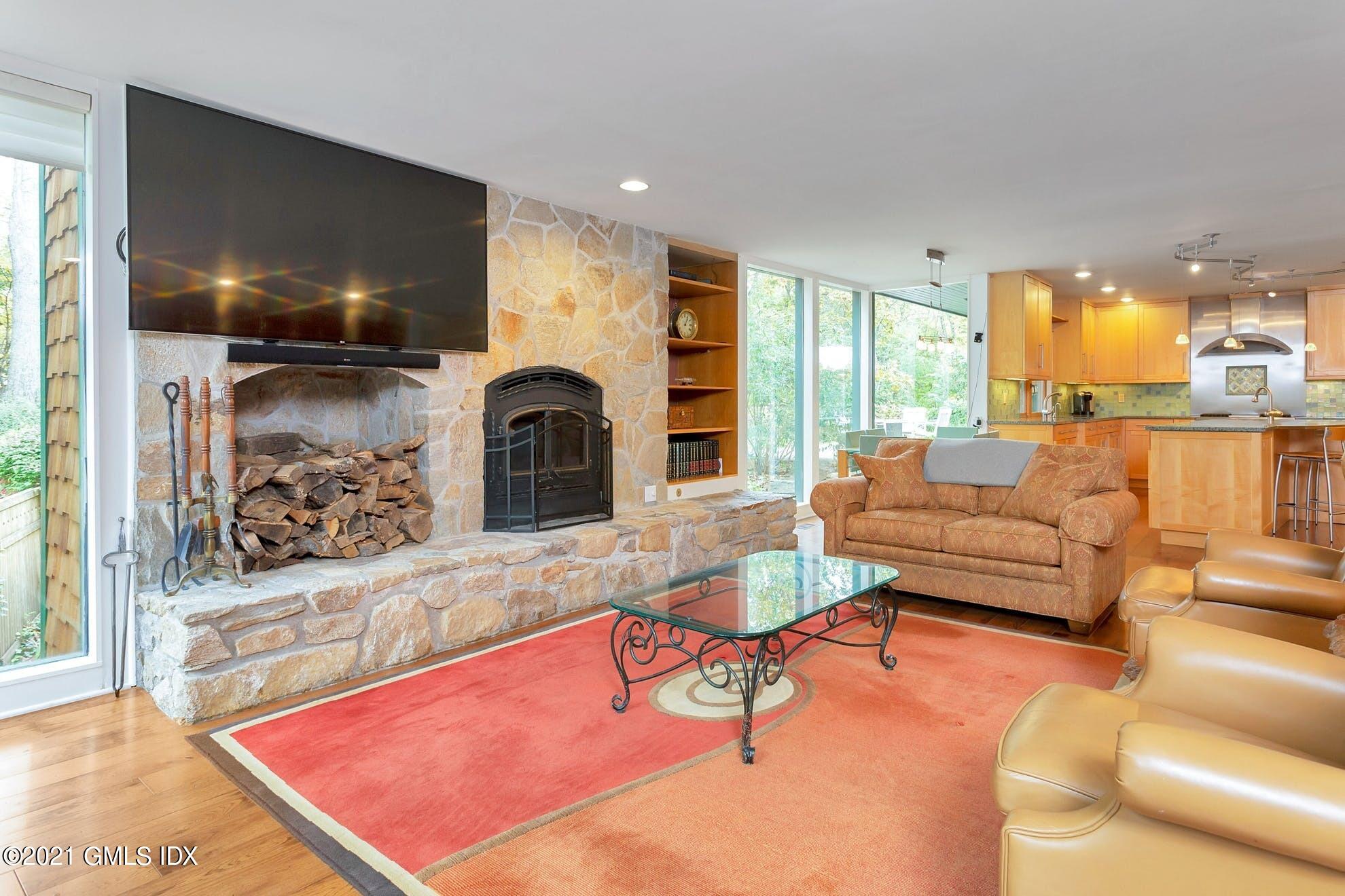 7 Chateau Ridge Road Greenwich, CT 06831 - Photo 9 of 36 a living room with furniture and a fireplace