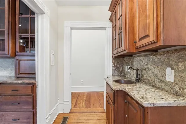 a kitchen with a stove and a sink