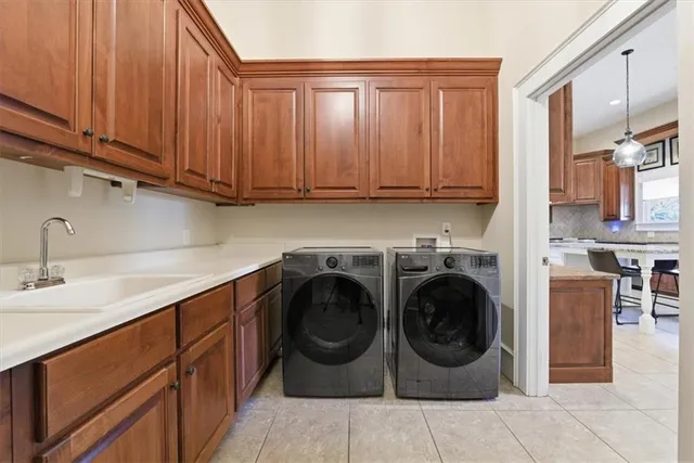 an empty room with ceiling fan and windows