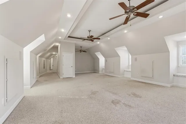 a bathroom with a granite countertop shower and a toilet