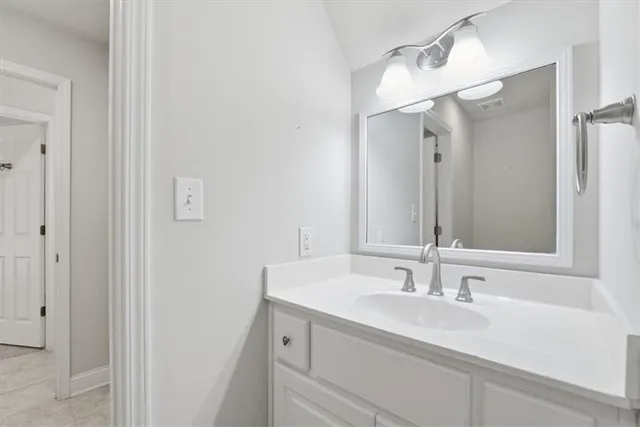 a view of an empty room with a fan