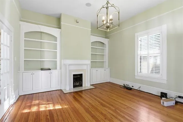 a view of livingroom with wooden floor and fireplace