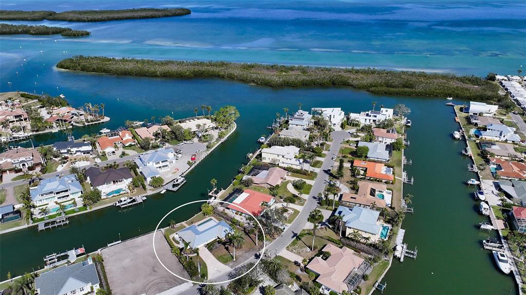 721 Old Compass Road Longboat Key, FL 34228 - Photo 1 of 21 view of a lake with lawn chairs