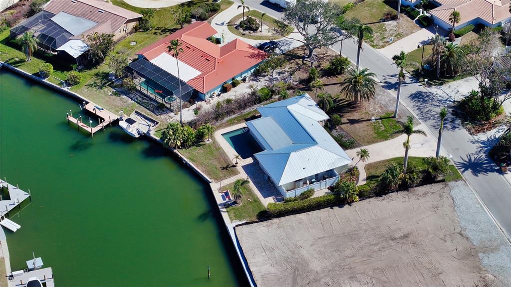 721 Old Compass Road Longboat Key, FL 34228 - Photo 12 of 21 an aerial view of a house with a garden and lake view