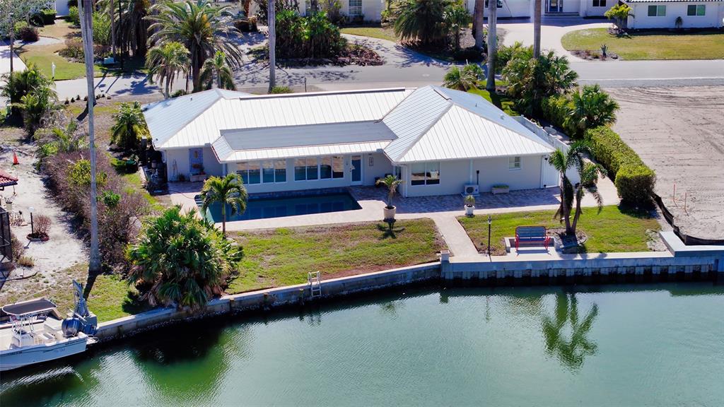 721 Old Compass Road Longboat Key, FL 34228 - Photo 17 of 21 an aerial view of a house with swimming pool having outdoor seating