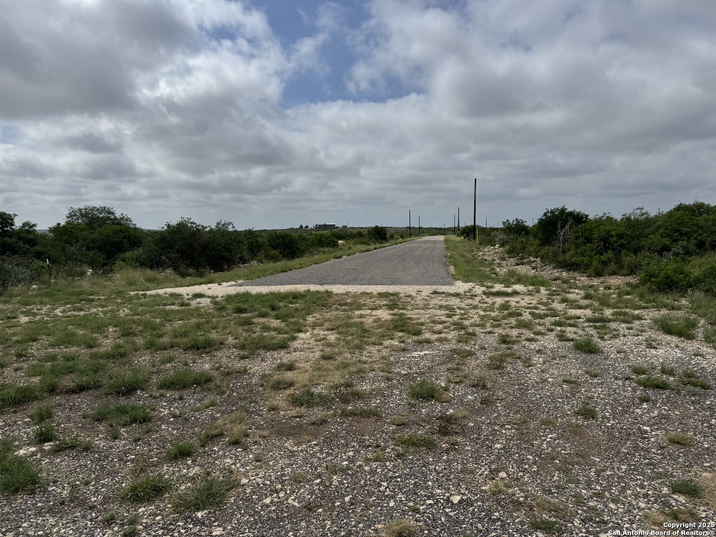 660 Legend Hills Uvalde, TX 78801 - Photo 3 of 13 a view of a lake with houses in the back