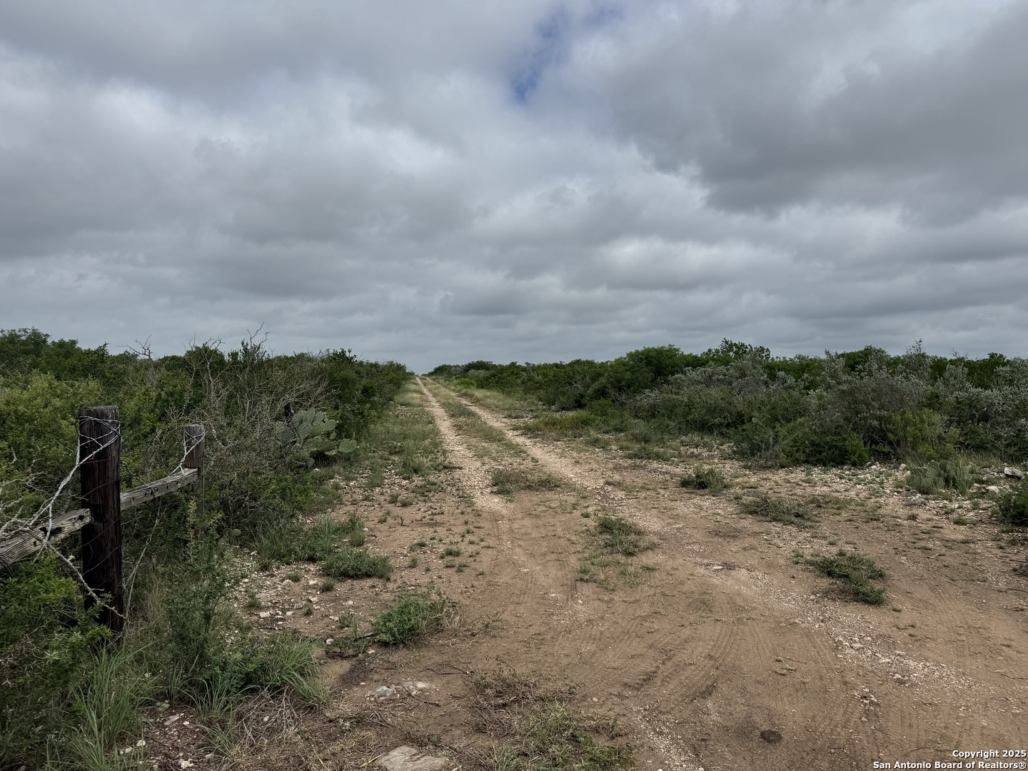 660 Legend Hills Uvalde, TX 78801 - Photo 4 of 13 a view of a field with trees in background