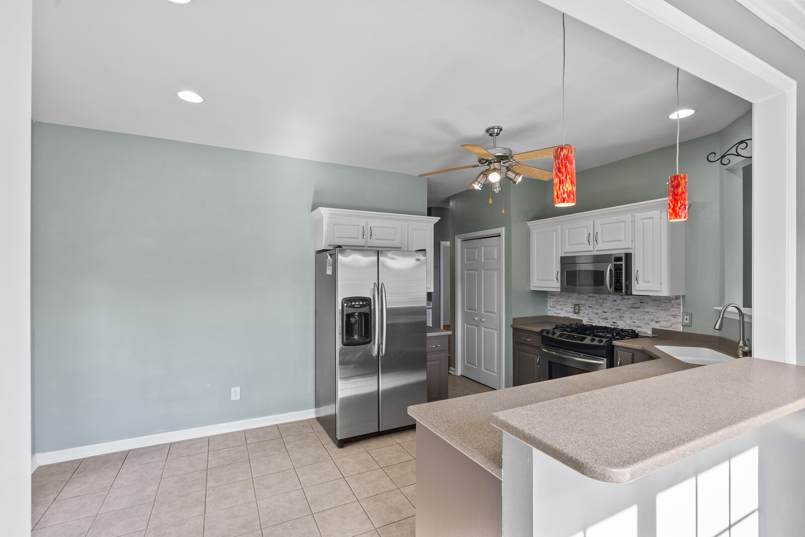 450 Brown Road Lebanon, TN 37087 - Photo 13 of 37 a kitchen with granite countertop a refrigerator and a stove