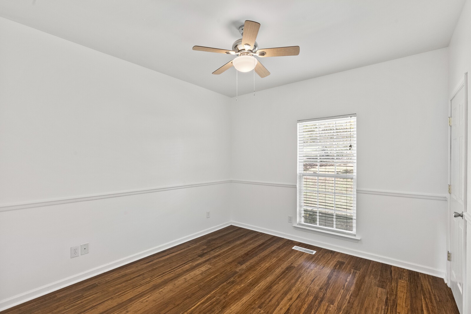 450 Brown Road Lebanon, TN 37087 - Photo 20 of 37 an empty room with wooden floor fan and windows