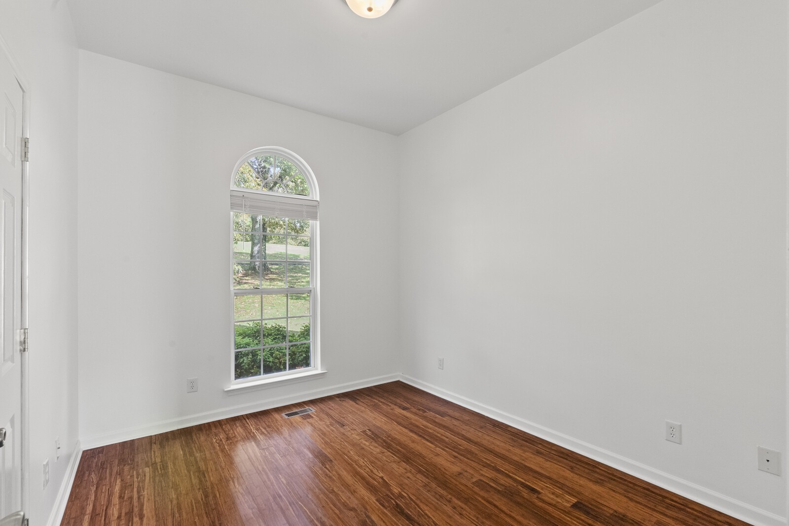450 Brown Road Lebanon, TN 37087 - Photo 22 of 37 an empty room with wooden floor and windows