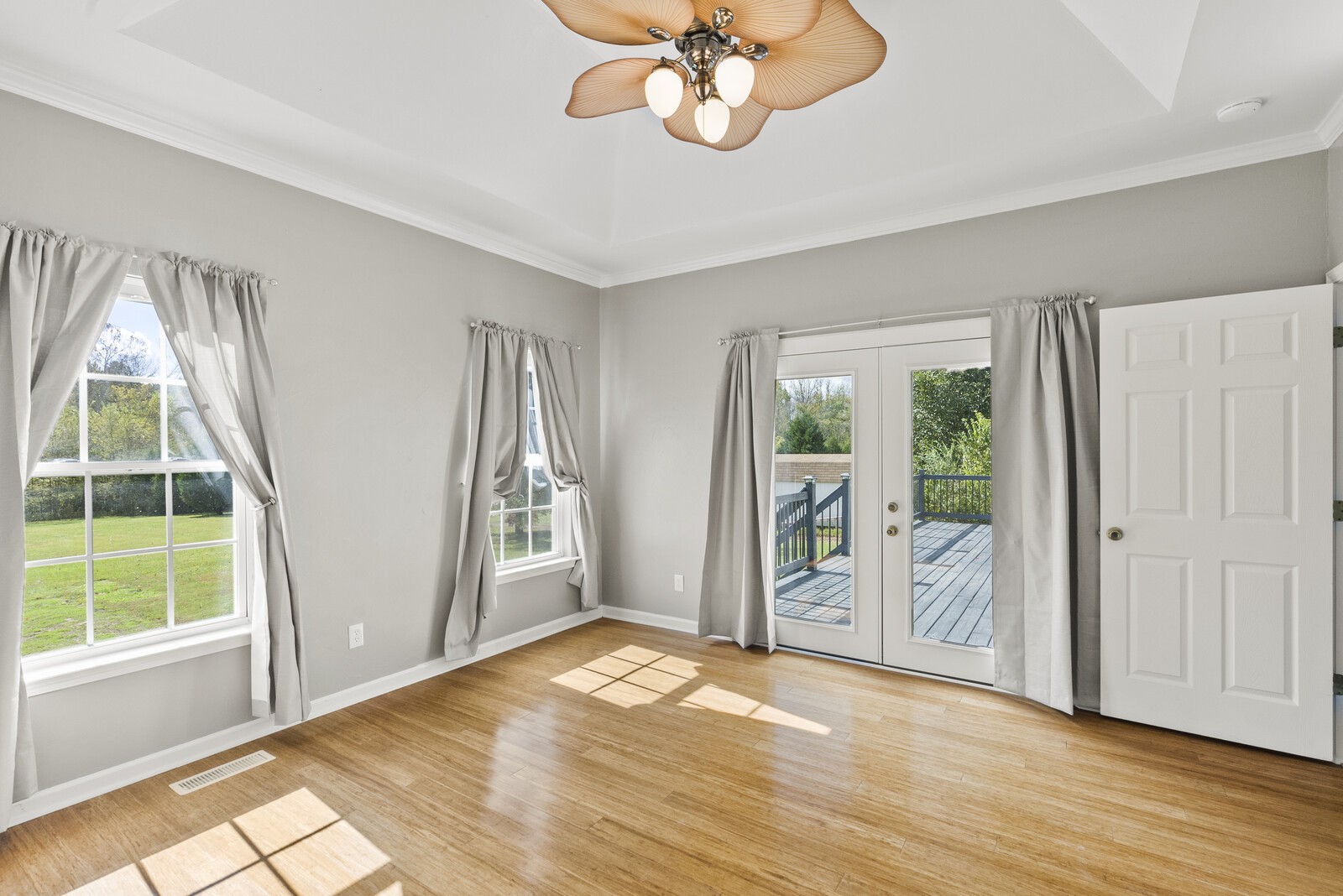 450 Brown Road Lebanon, TN 37087 - Photo 26 of 37 an empty room with wooden floor fan and windows