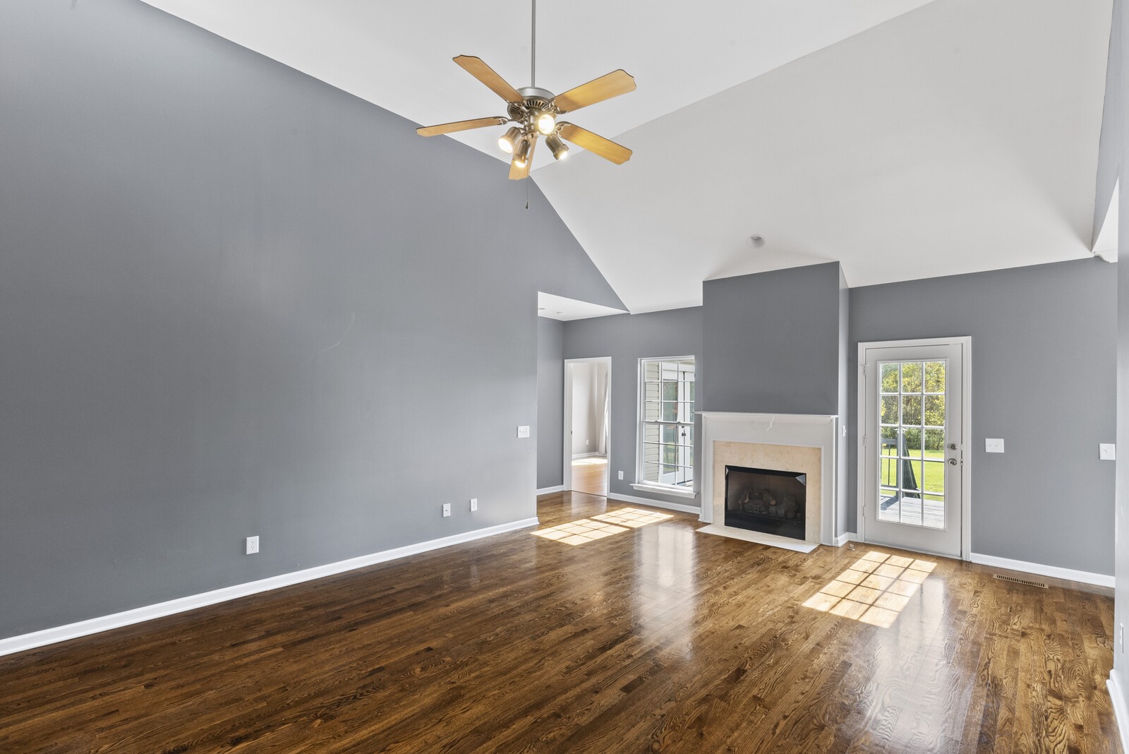450 Brown Road Lebanon, TN 37087 - Photo 10 of 37 a view of an empty room with a fireplace and a window