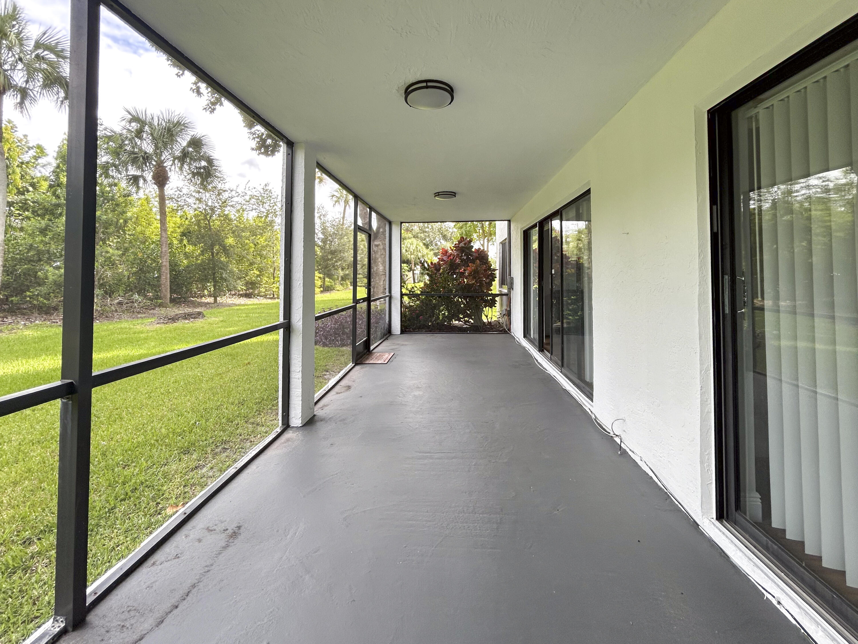 9235 Southwest 8th Street, Unit 114 Boca Raton, FL 33428 - Photo 1 of 18 a view of hallway