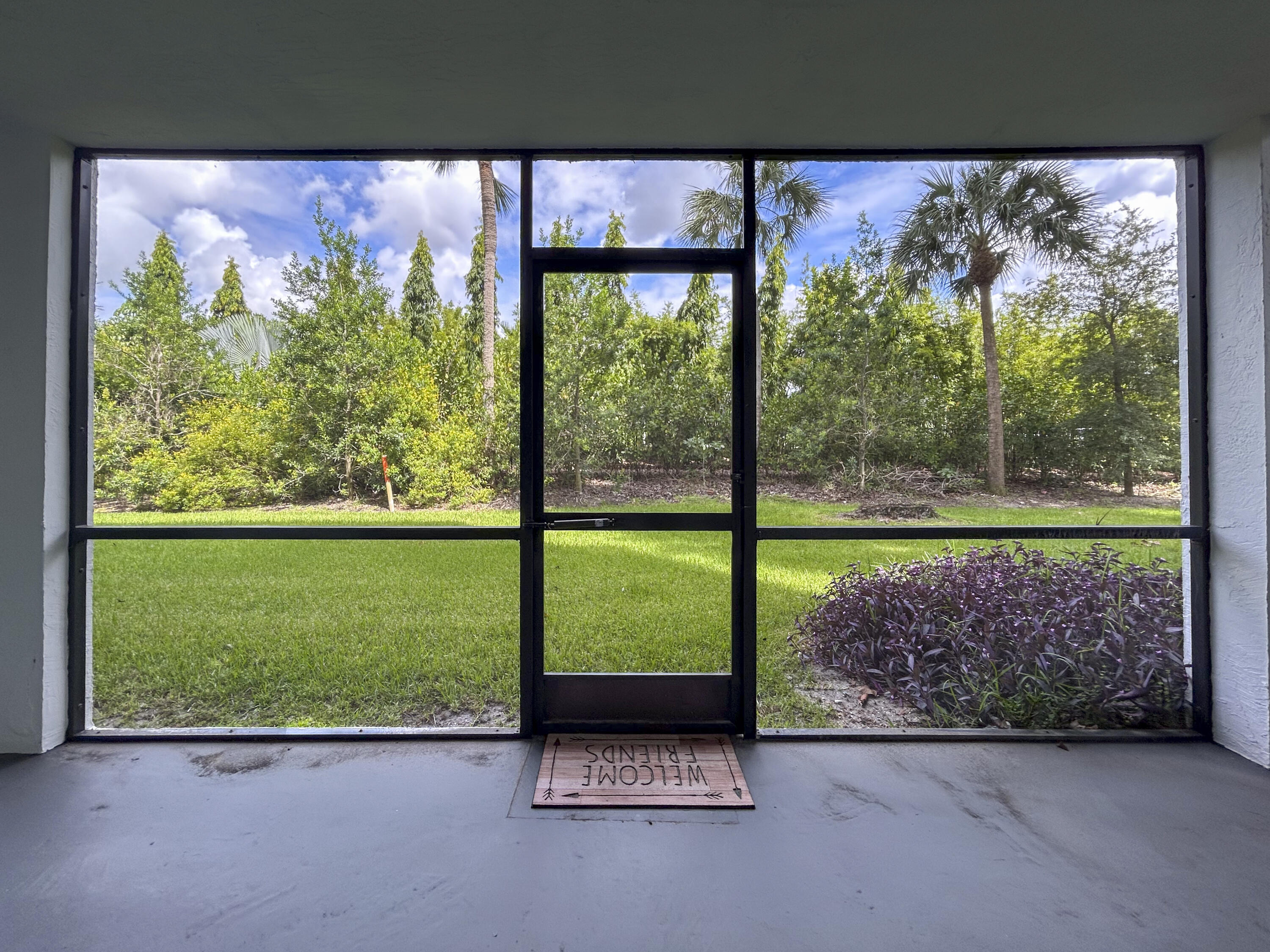 9235 Southwest 8th Street, Unit 114 Boca Raton, FL 33428 - Photo 4 of 18 a view of room with a floor to ceiling window and a floor to ceiling window