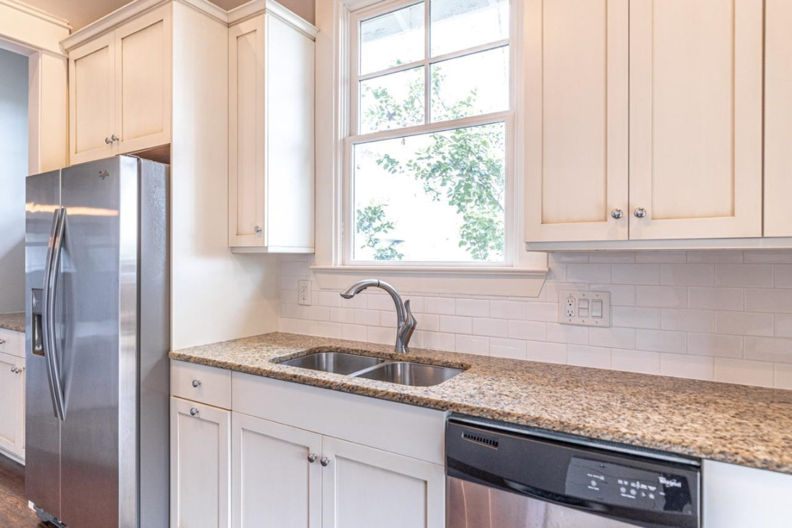 Undisclosed Address Raleigh, NC 27605 - Photo 13 of 29 a kitchen with stainless steel appliances granite countertop a sink and a window