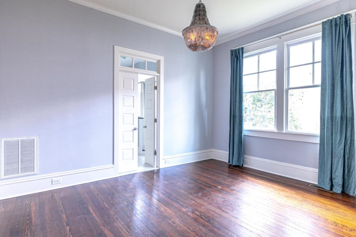 Undisclosed Address Raleigh, NC 27605 - Photo 14 of 29 an empty room with wooden floor and window