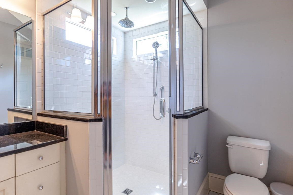 Undisclosed Address Raleigh, NC 27605 - Photo 16 of 29 a bathroom with a toilet sink and shower