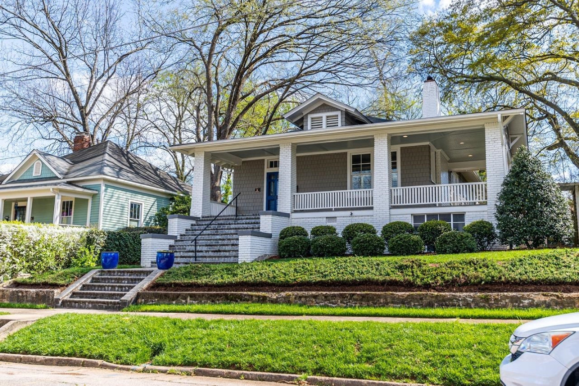 Undisclosed Address Raleigh, NC 27605 - Photo 2 of 29 a front view of a house with a yard