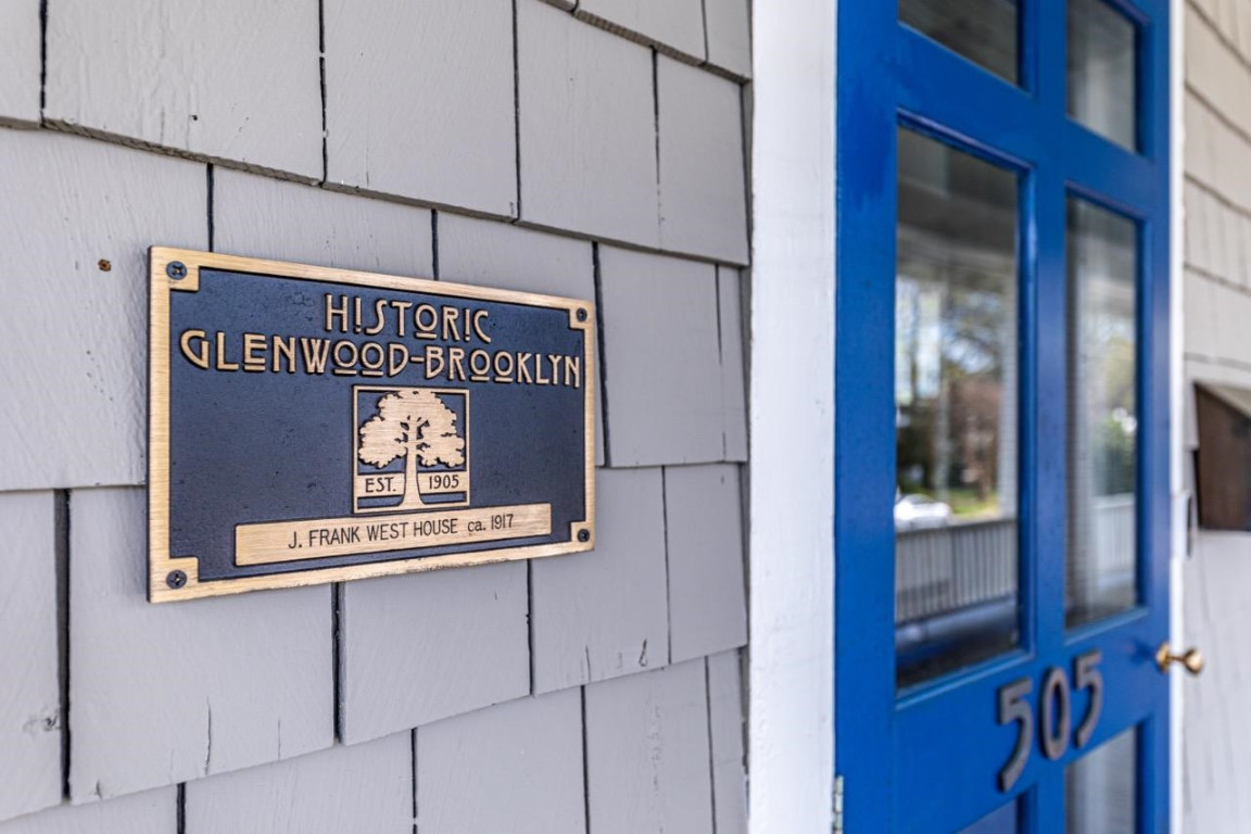 Undisclosed Address Raleigh, NC 27605 - Photo 27 of 29 a sign on the side of a building