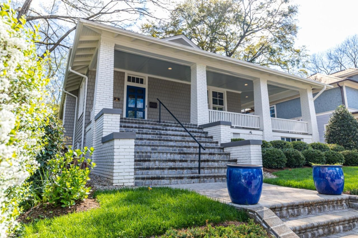 Undisclosed Address Raleigh, NC 27605 - Photo 28 of 29 a front view of a house with garden