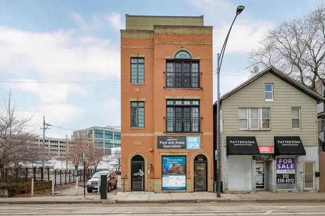 a front view of a building with glass windows