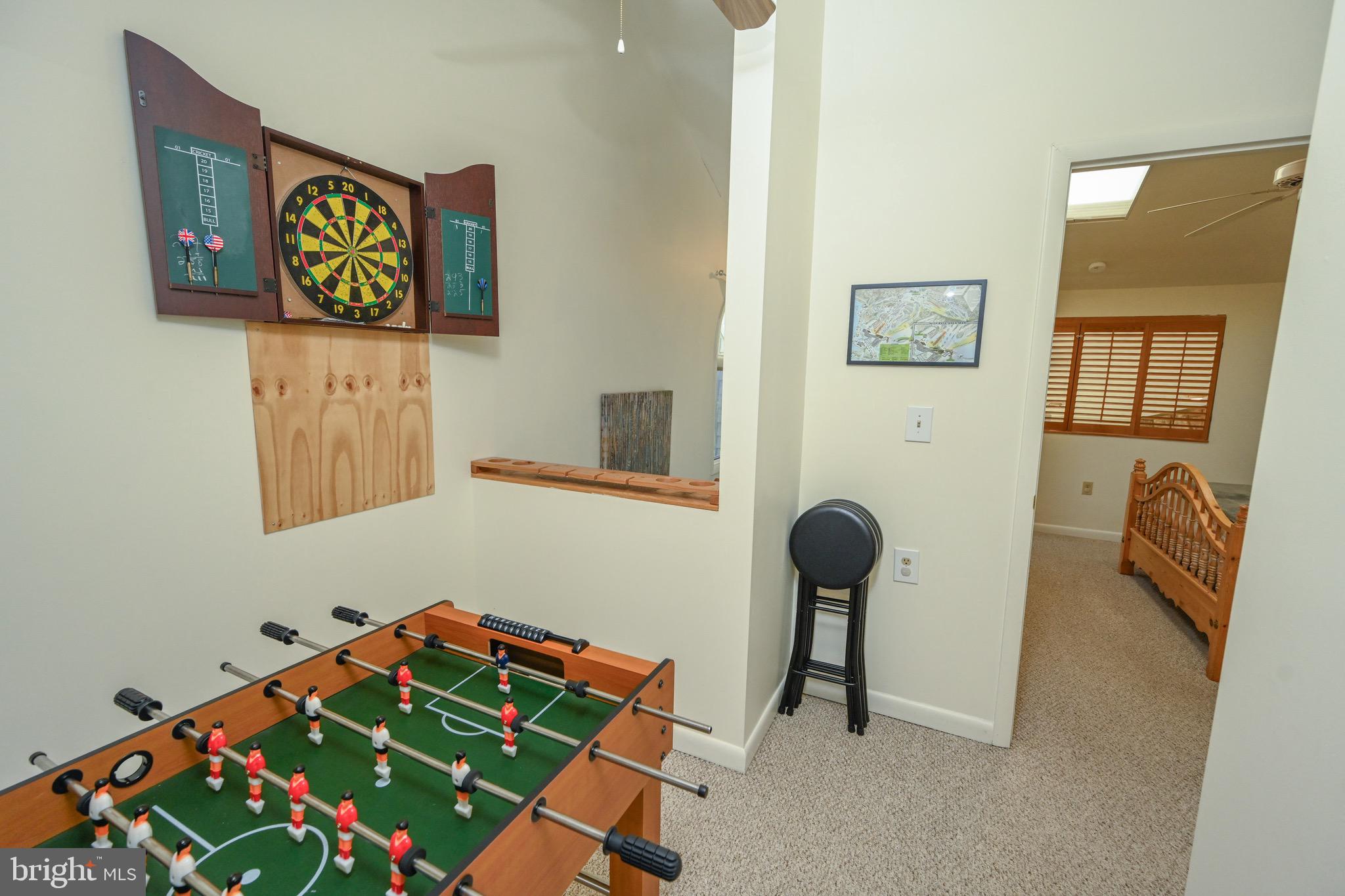 257 Marsh Hill Road, Unit 1 McHenry, MD 21541 - Photo 24 of 50 a room with toys and a chair