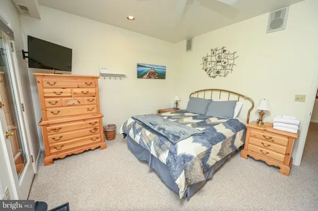 a bedroom with a bed and a fireplace