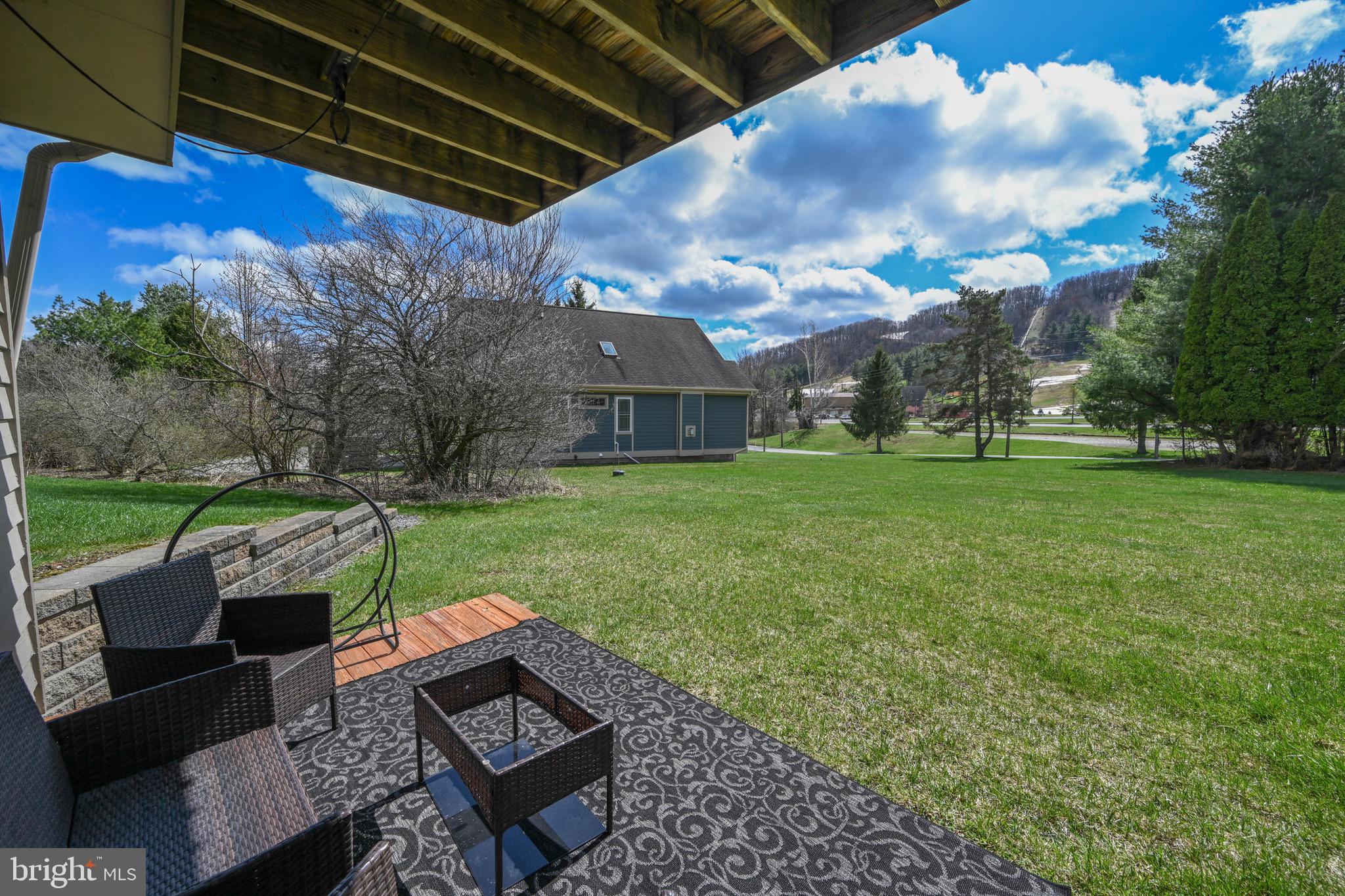 257 Marsh Hill Road, Unit 1 McHenry, MD 21541 - Photo 29 of 50 a view of a backyard with sitting area