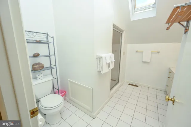 a bathroom with a sink mirror toilet and bathtub