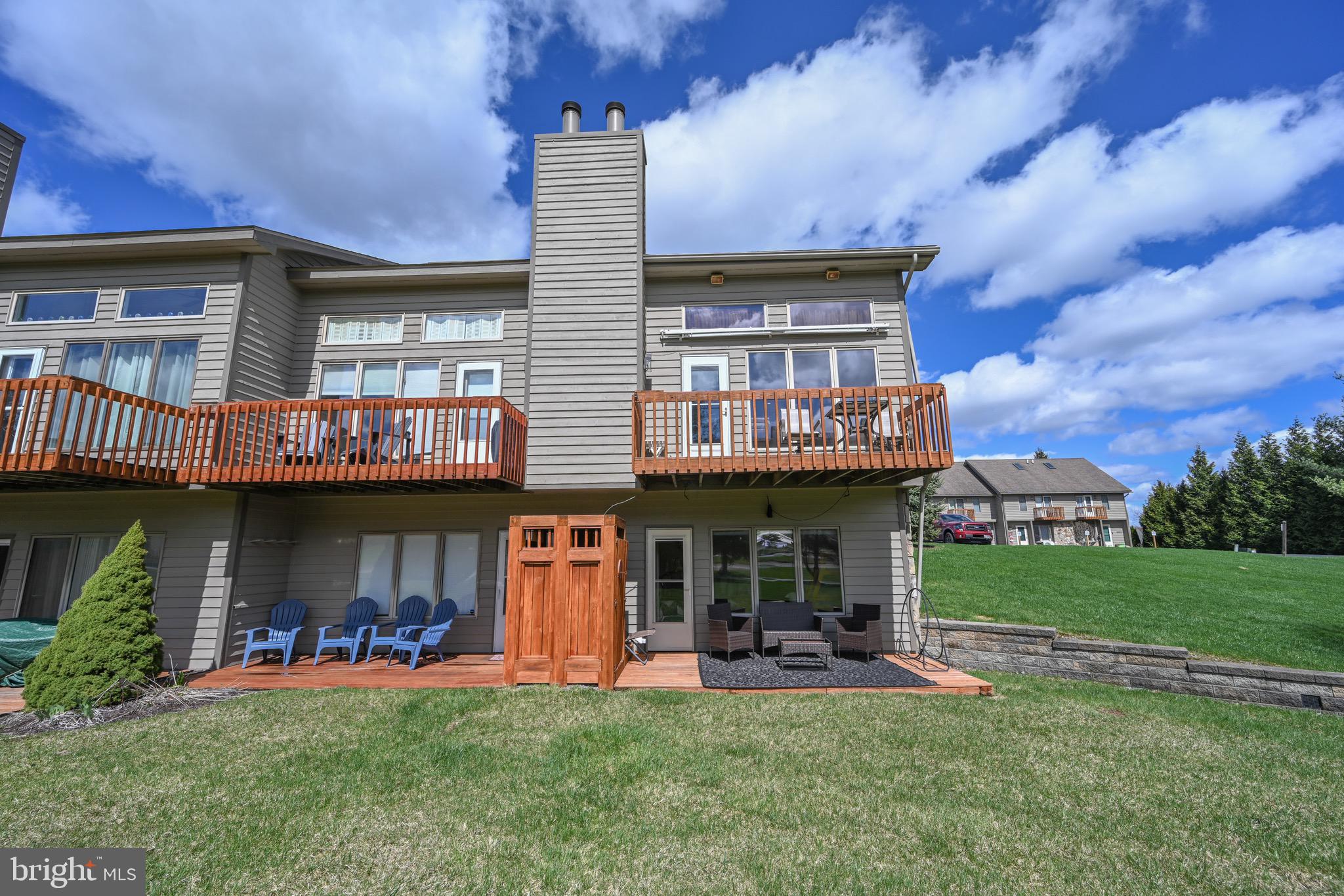 257 Marsh Hill Road, Unit 1 McHenry, MD 21541 - Photo 33 of 50 a view of a house with sitting area and garden
