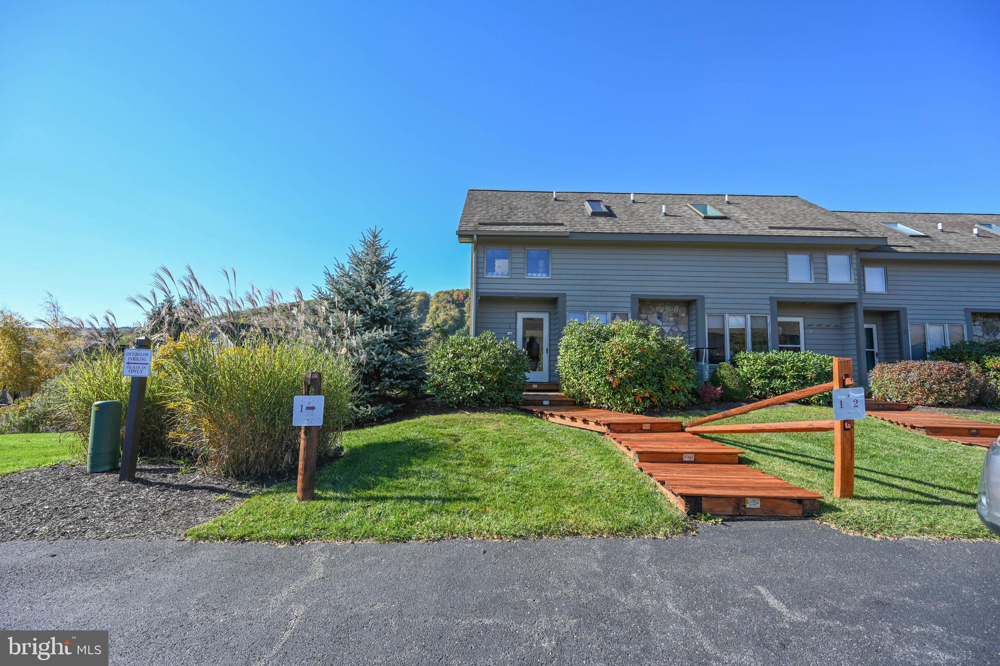 257 Marsh Hill Road, Unit 1 McHenry, MD 21541 - Photo 43 of 50 a front view of a house with a yard