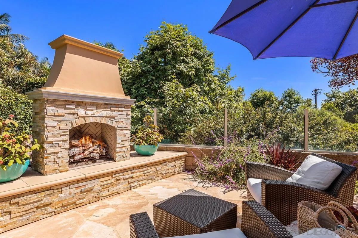 2726 MacKinnon Ranch Road Cardiff, CA 92007 - Photo 25 of 28 a view of a couches and a fireplace in the patio