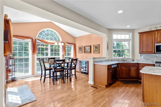 a view of a dining room with furniture window and wooden floor