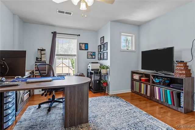 a view of a livingroom with furniture and a flat screen tv