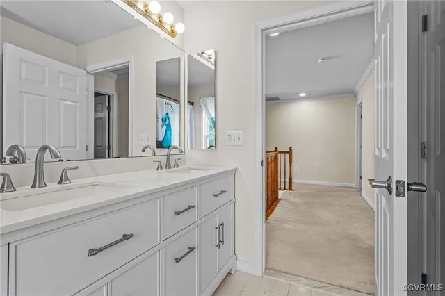 a bathroom with a granite countertop sink mirror and double
