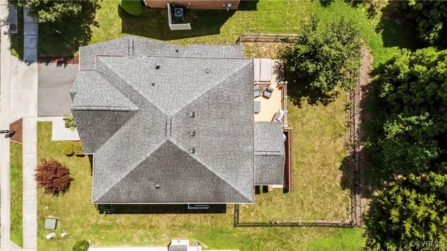 a aerial view of a house with a yard