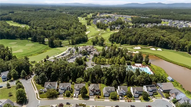 a aerial view of a house with a yard