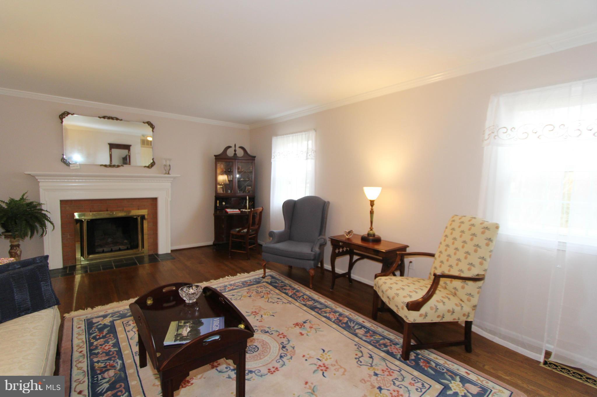 2000 Byrd Road Vienna, VA 22182 - Photo 14 of 30 a living room with furniture and a fireplace