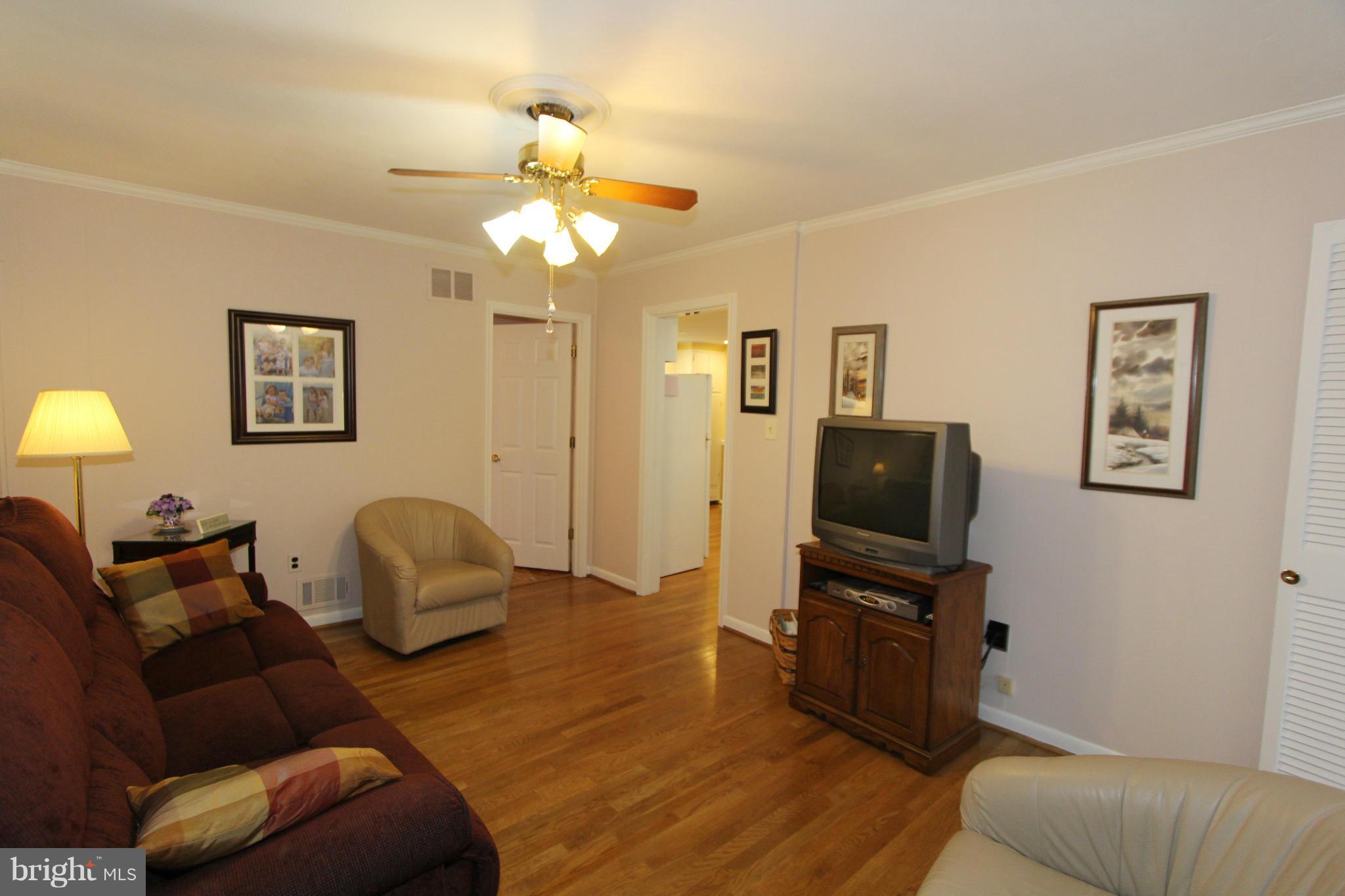2000 Byrd Road Vienna, VA 22182 - Photo 20 of 30 a living room with furniture and a flat screen tv