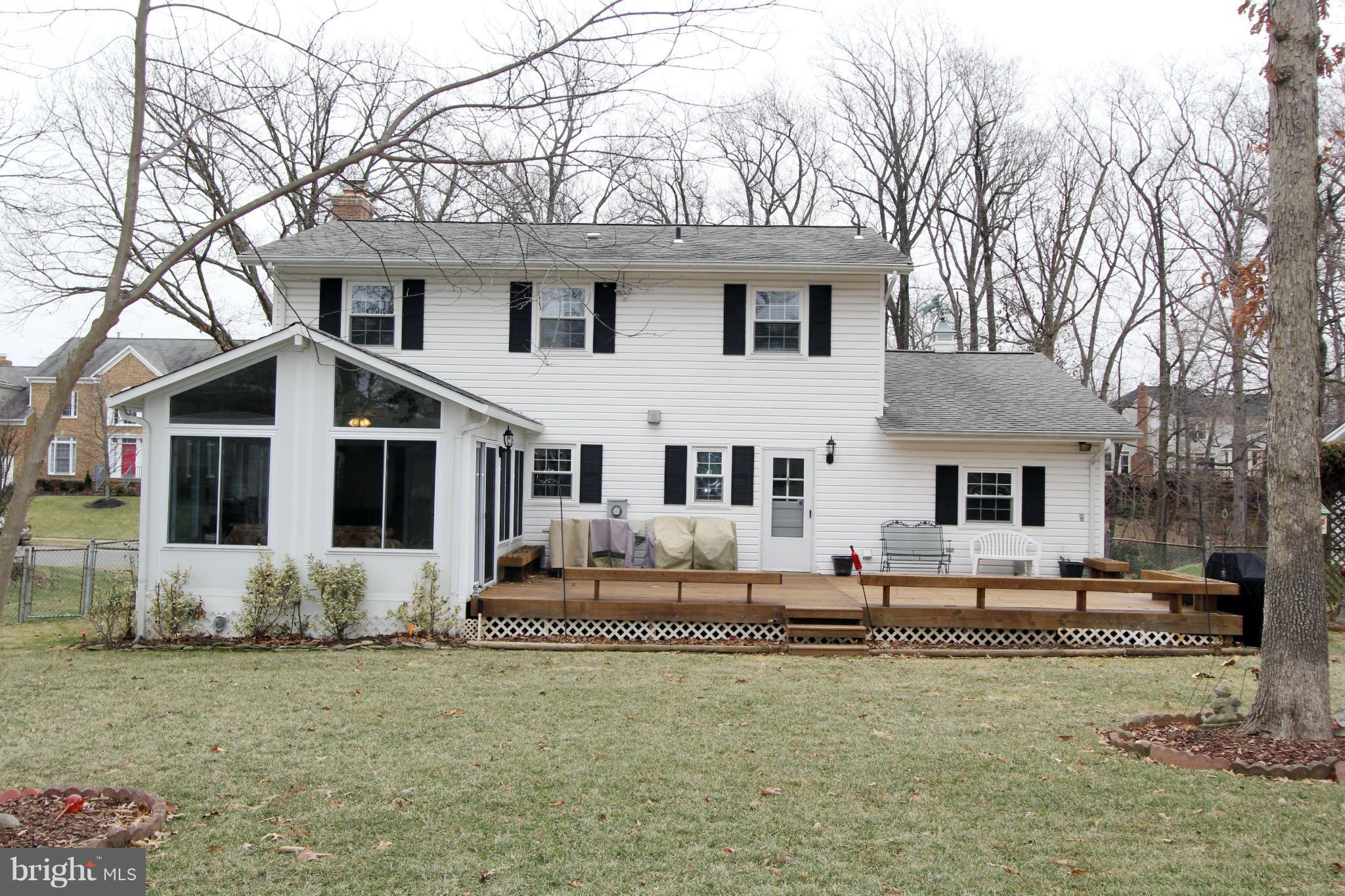 2000 Byrd Road Vienna, VA 22182 - Photo 3 of 30 a front view of a house with a yard outdoor seating and garage