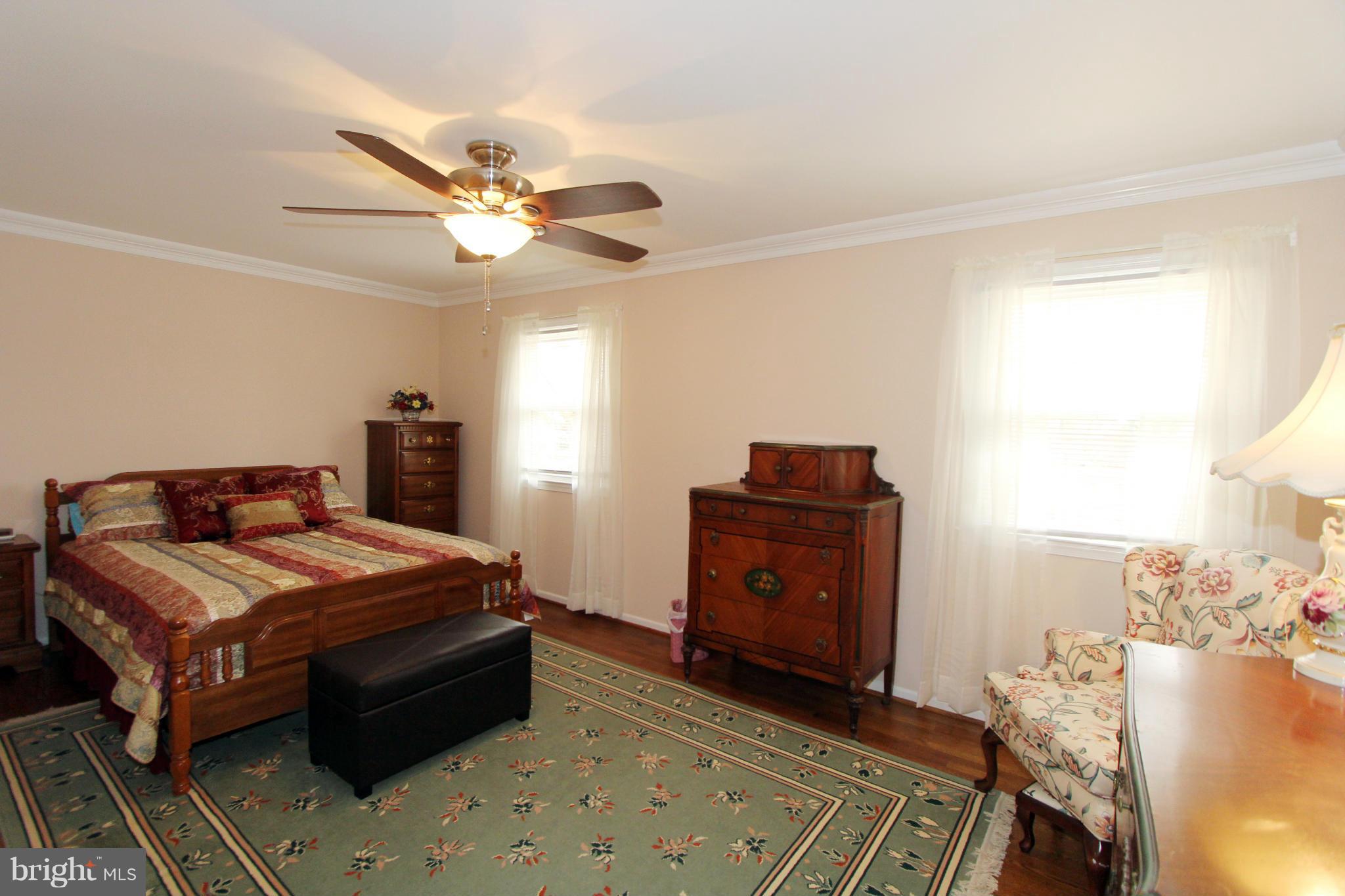 2000 Byrd Road Vienna, VA 22182 - Photo 23 of 30 a bedroom with a bed and a ceiling fan