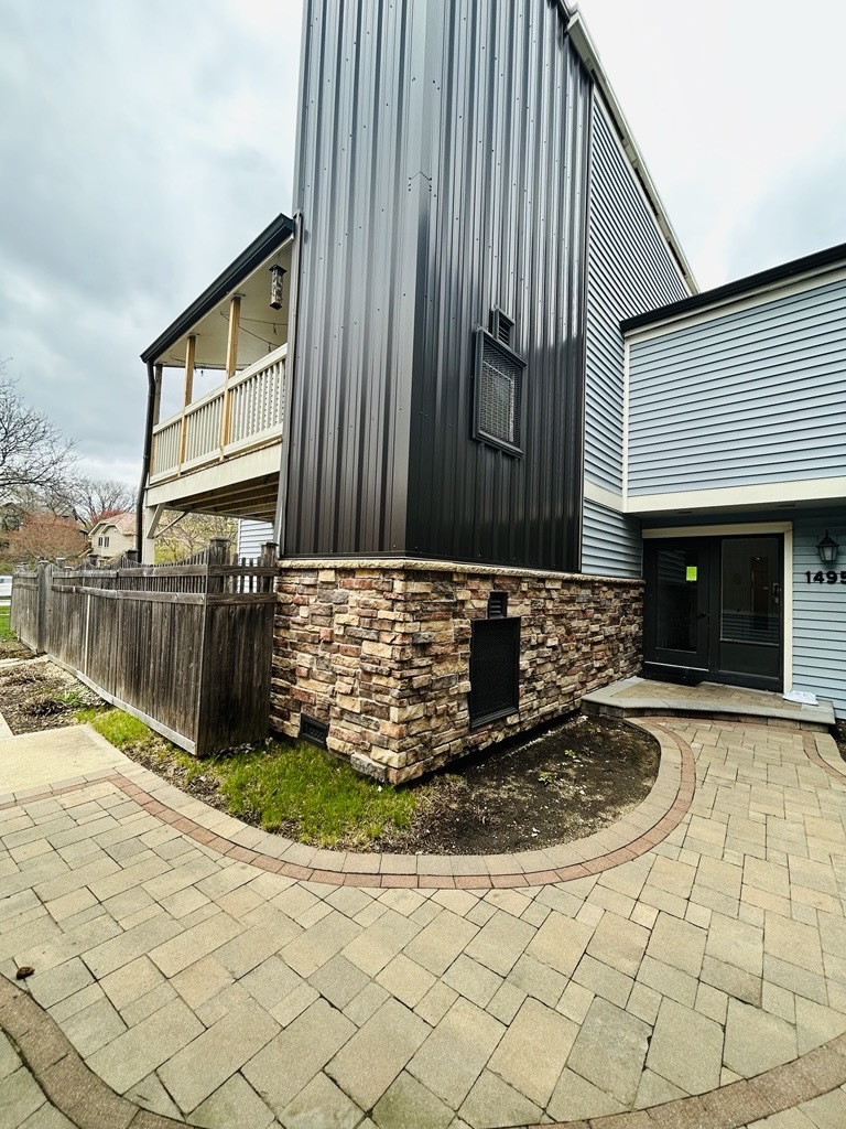 1495 South County Farm Road, Unit 23 Wheaton, IL 60189 - Photo 1 of 21 a view of a back yard of a house
