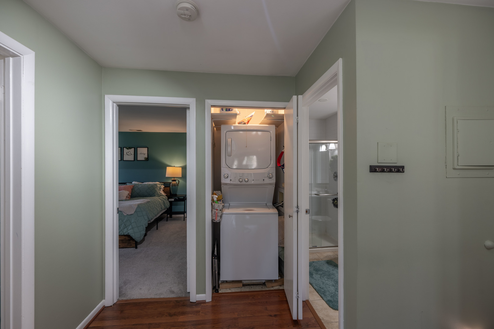1495 South County Farm Road, Unit 23 Wheaton, IL 60189 - Photo 11 of 21 a view of a hallway with a livingroom and couch