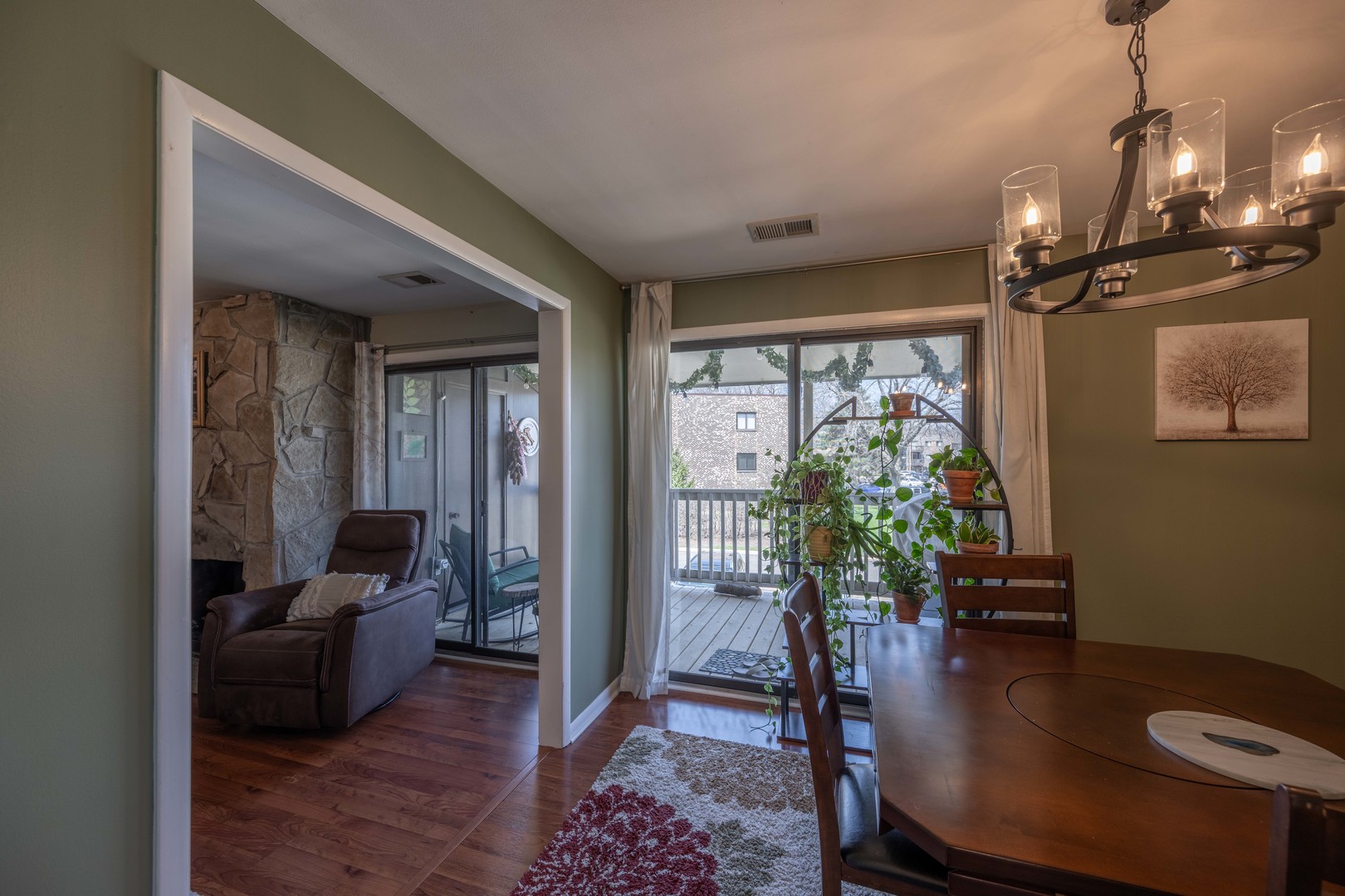 1495 South County Farm Road, Unit 23 Wheaton, IL 60189 - Photo 15 of 21 a living room with furniture and a large window